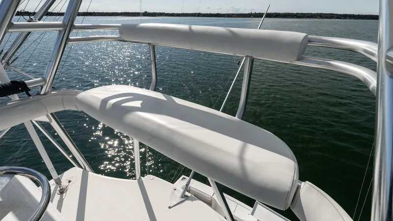 Life Of Reilly 2.0 Yacht Photos Pics Cabo 44 HTX 2012 boat deck with cushioned seating overlooking water.