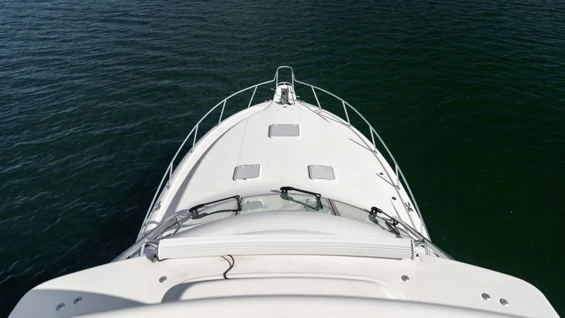 Life Of Reilly 2.0 Yacht Photos Pics Cabo 44 HTX 2012 yacht bow view on calm water.