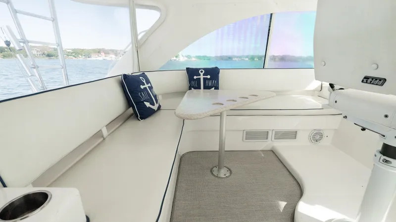 Life Of Reilly 2.0 Yacht Photos Pics Interior of 2012 Cabo 44 HTX yacht with seating and nautical-themed cushions.