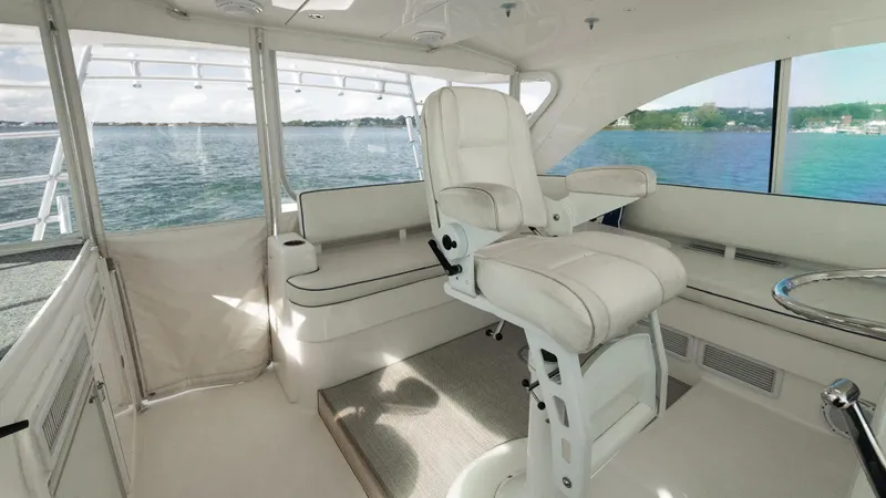 Life Of Reilly 2.0 Yacht Photos Pics Luxurious interior of 2012 Cabo 44 HTX yacht with plush seating and scenic water view.