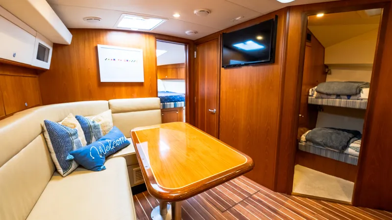 Life Of Reilly 2.0 Yacht Photos Pics Luxurious interior of 2012 Cabo 44 HTX yacht with cozy seating and modern amenities.