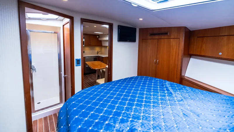 Life Of Reilly 2.0 Yacht Photos Pics Luxurious interior of 2012 Cabo 44 HTX yacht with bedroom and ensuite bathroom.