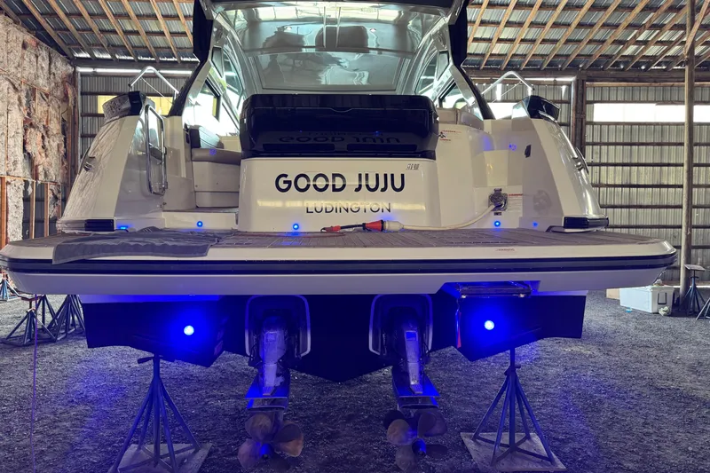  Yacht Photos Pics 2016 Beneteau Gran Turismo 40 yacht in storage, rear view with blue lights.