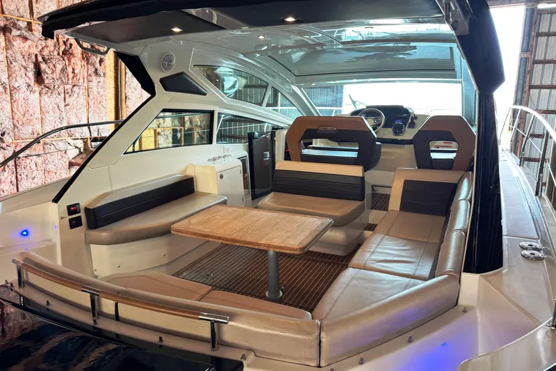  Yacht Photos Pics 2016 Beneteau Gran Turismo 40 yacht interior with seating and table.