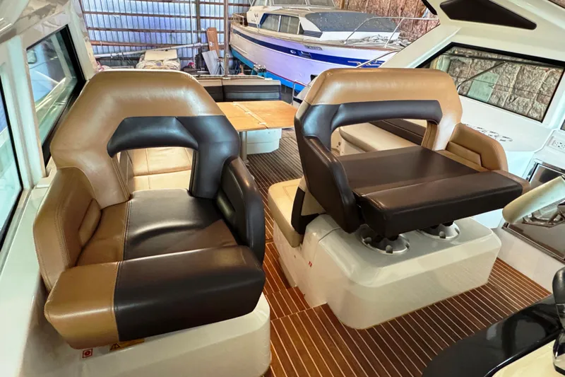  Yacht Photos Pics Interior of 2016 Beneteau Gran Turismo 40 with luxurious seating and wooden flooring.
