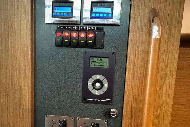  Yacht Photos Pics Control panel of a 2016 Beneteau Gran Turismo 40 yacht, featuring digital displays and switches.