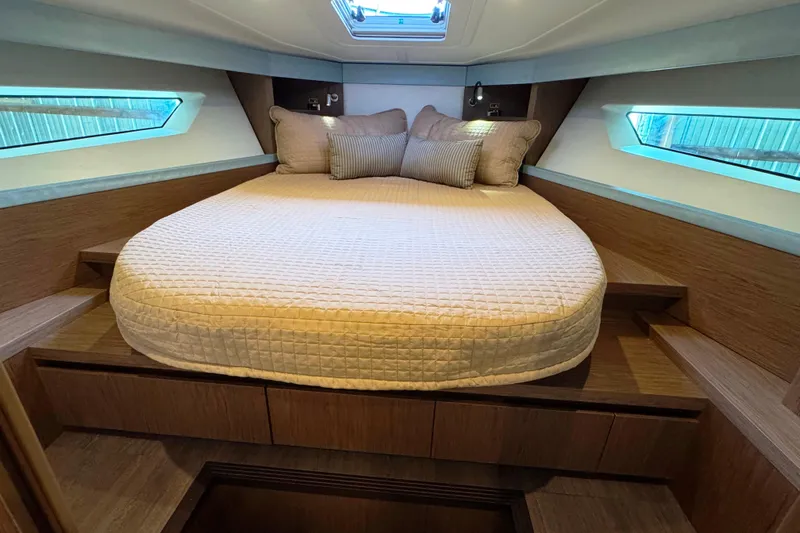  Yacht Photos Pics Luxurious cabin interior of 2016 Beneteau Gran Turismo 40 yacht with cozy bed and modern design.