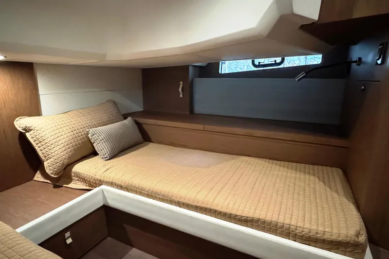  Yacht Photos Pics Cozy cabin interior of 2016 Beneteau Gran Turismo 40 yacht with comfortable bedding.