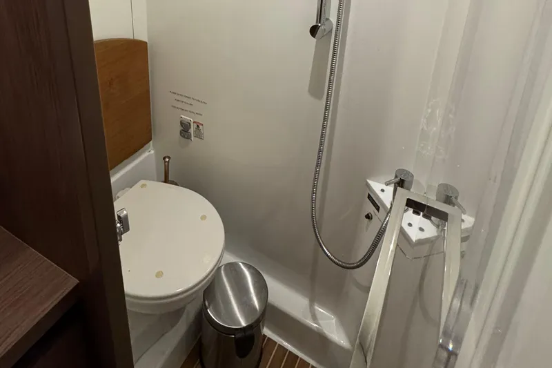  Yacht Photos Pics Bathroom interior of 2016 Beneteau Gran Turismo 40 yacht, featuring shower and toilet.