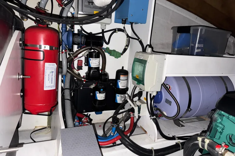  Yacht Photos Pics Engine room of 2016 Beneteau Gran Turismo 40 with various mechanical components.