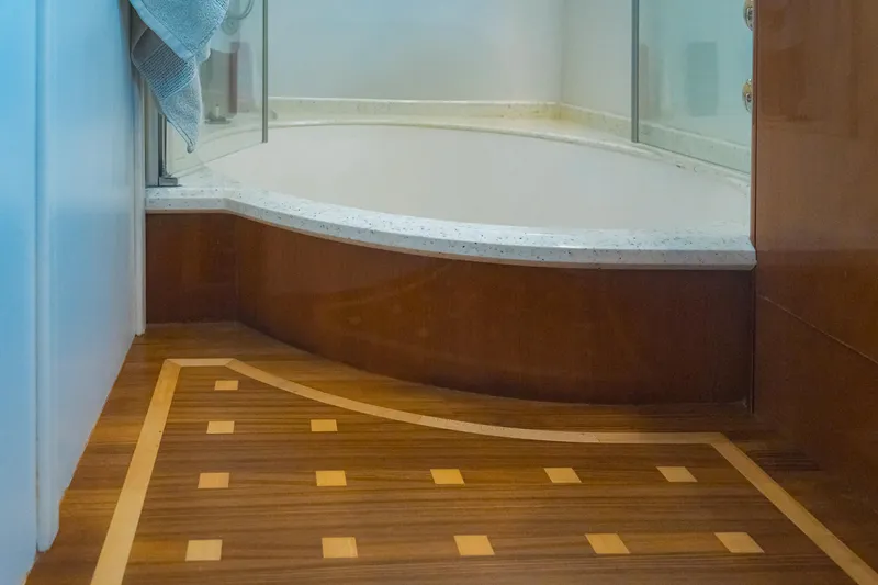 Odeya Yacht Photos Pics Luxurious bathroom interior of 2004 Princess 82 Motor Yacht with elegant wood flooring.