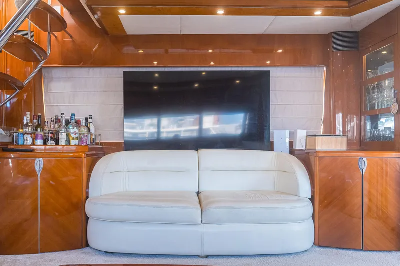 Odeya Yacht Photos Pics Luxurious interior of 2004 Princess 82 Motor Yacht with leather sofa and bar.