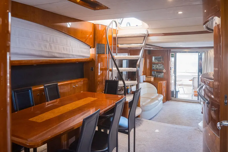 Odeya Yacht Photos Pics Luxurious interior of 2004 Princess 82 Motor Yacht with elegant dining area and spiral staircase.