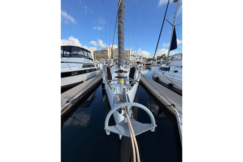 Set Free Yacht Photos Pics 2007 Beneteau 49 sailboat docked at marina under clear blue sky.