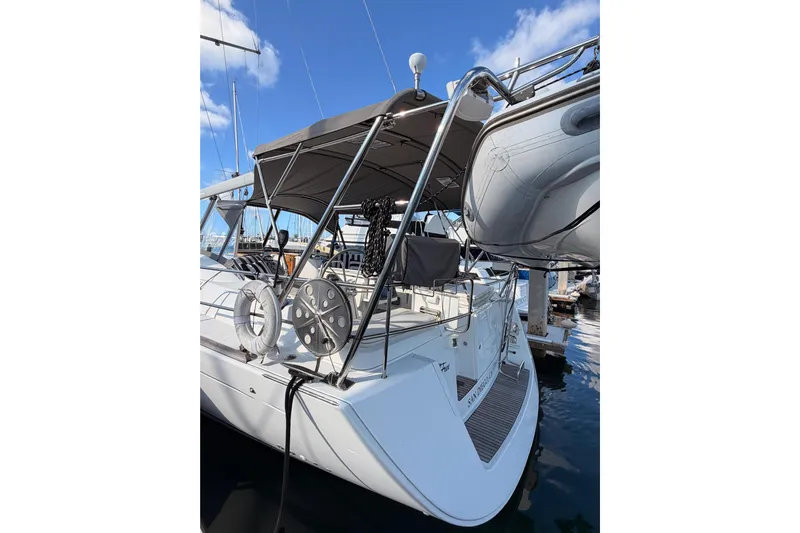 Set Free Yacht Photos Pics 2007 Beneteau 49 yacht docked, featuring a spacious deck and modern design.