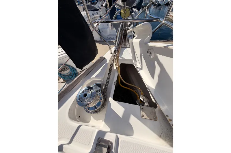 Set Free Yacht Photos Pics Deck view of a 2007 Beneteau 49 sailboat, featuring anchor chain and winch.