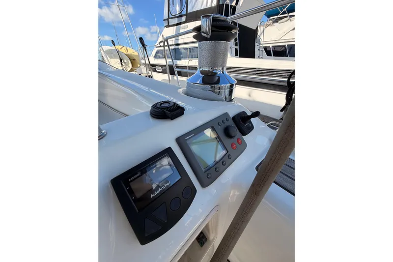 Set Free Yacht Photos Pics Control panel on a 2007 Beneteau 49 sailboat, featuring navigation instruments and winch.