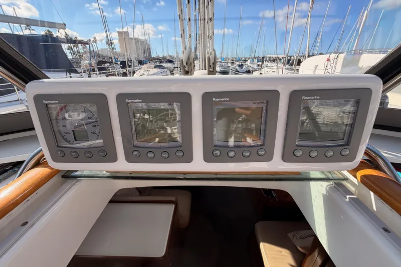 Set Free Yacht Photos Pics Control panel of a 2007 Beneteau 49 yacht with Raymarine displays.