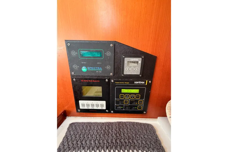 Set Free Yacht Photos Pics Control panel on a 2007 Beneteau 49 yacht featuring Xantrex and Spectra systems.