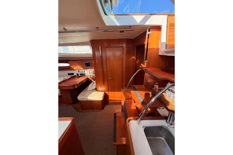 Set Free Yacht Photos Pics Interior of 2007 Beneteau 49 yacht with wooden finish and modern amenities.