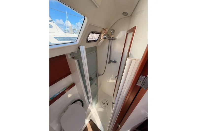 Set Free Yacht Photos Pics Bathroom interior of 2007 Beneteau 49 yacht with shower and toilet.