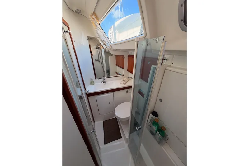 Set Free Yacht Photos Pics Bathroom interior of 2007 Beneteau 49 yacht with shower and vanity.
