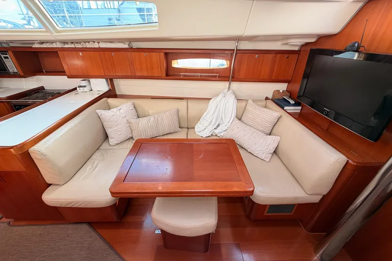 Set Free Yacht Photos Pics Luxurious interior of a 2007 Beneteau 49 yacht with cozy seating and modern amenities.