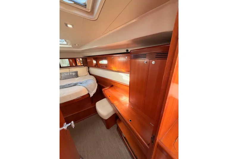 Set Free Yacht Photos Pics Luxurious cabin interior of 2007 Beneteau 49 yacht with wooden furnishings.