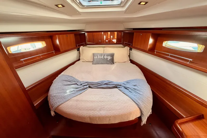 Set Free Yacht Photos Pics Luxurious cabin interior of a 2007 Beneteau 49 yacht with cozy bedding.