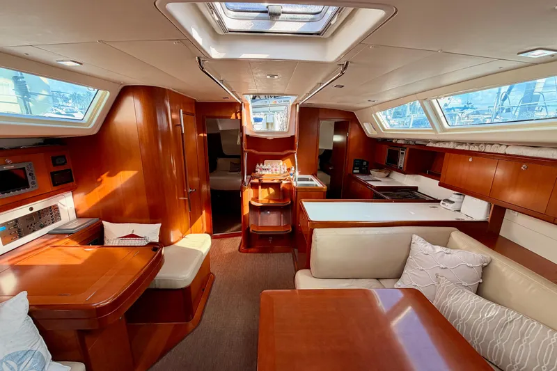Set Free Yacht Photos Pics Luxurious interior of 2007 Beneteau 49 yacht with wood finish and modern amenities.