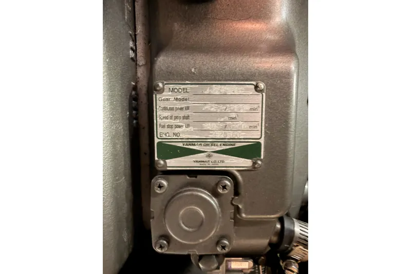 Set Free Yacht Photos Pics Engine plate of a 2007 Beneteau 49 sailboat, featuring Yanmar diesel engine details.