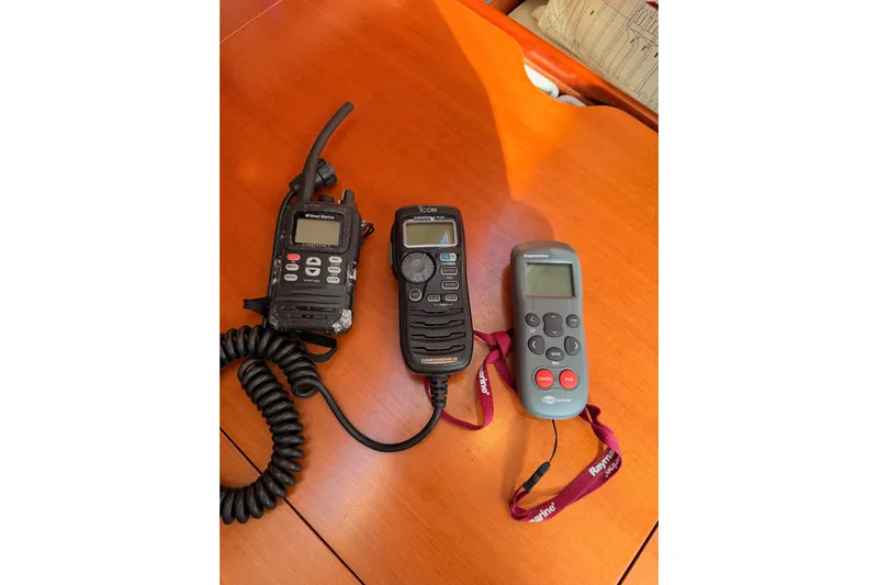 Set Free Yacht Photos Pics Three marine communication devices on a wooden surface, suitable for a 2007 Beneteau 49 yacht.