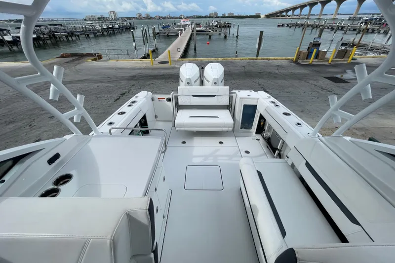  Yacht Photos Pics 2022 Blackfin 272 DC boat interior with spacious seating and waterfront view.