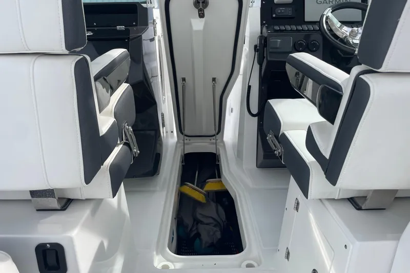  Yacht Photos Pics Interior of 2022 Blackfin 272 DC boat with white and black seating.