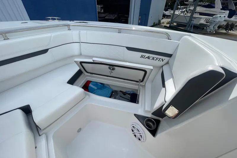  Yacht Photos Pics 2022 Blackfin 272 DC boat interior with open storage compartment and seating.
