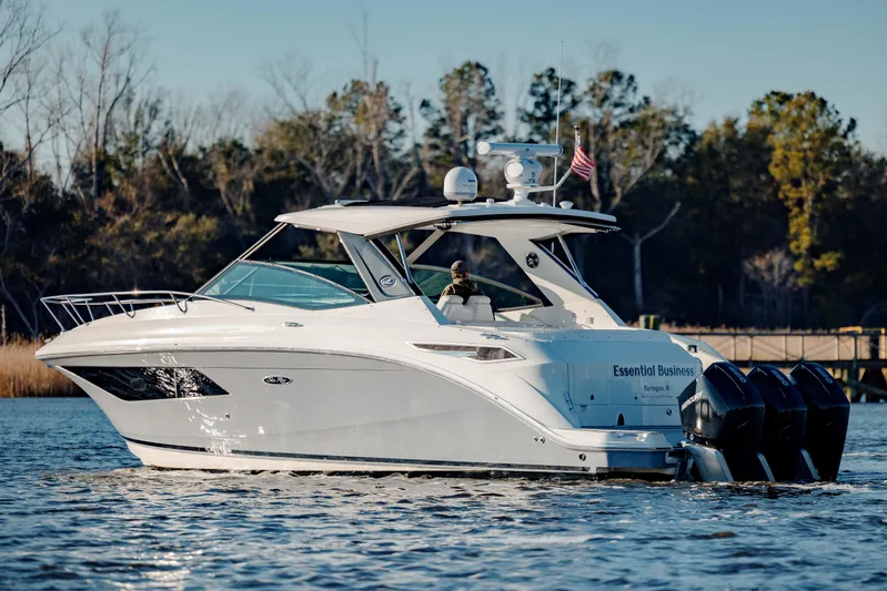  Yacht Photos Pics 2019 Sea Ray 320 Sundancer OB cruising on a calm lake.