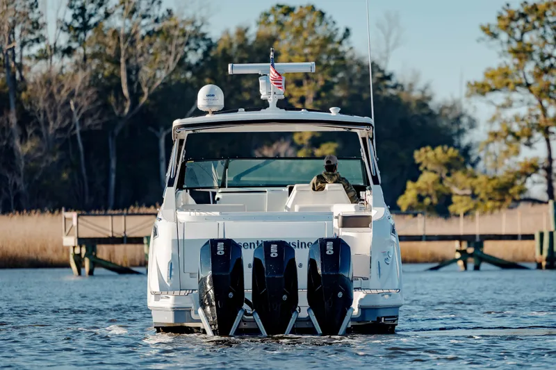  Yacht Photos Pics 2019 Sea Ray 320 Sundancer OB cruising on a calm lake.