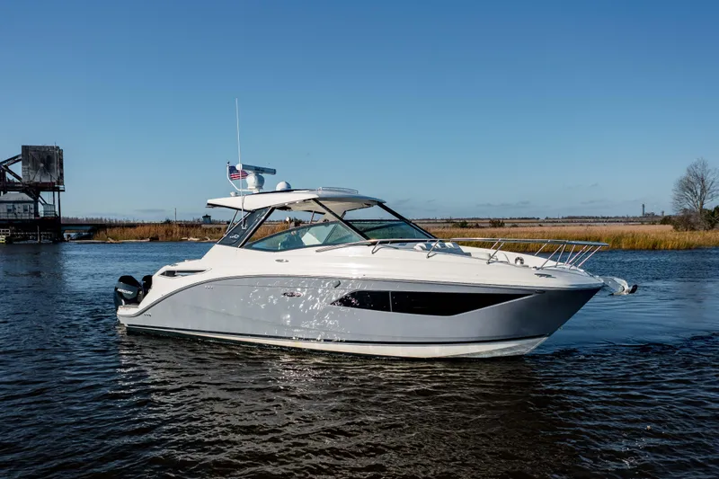  Yacht Photos Pics 2019 Sea Ray 320 Sundancer OB cruising on a calm river.