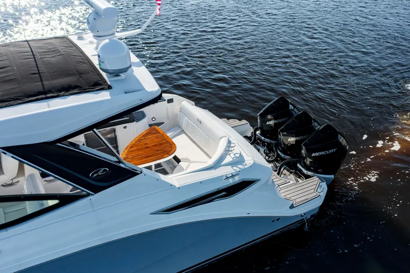  Yacht Photos Pics 2019 Sea Ray 320 Sundancer OB with triple Mercury outboard engines on water.