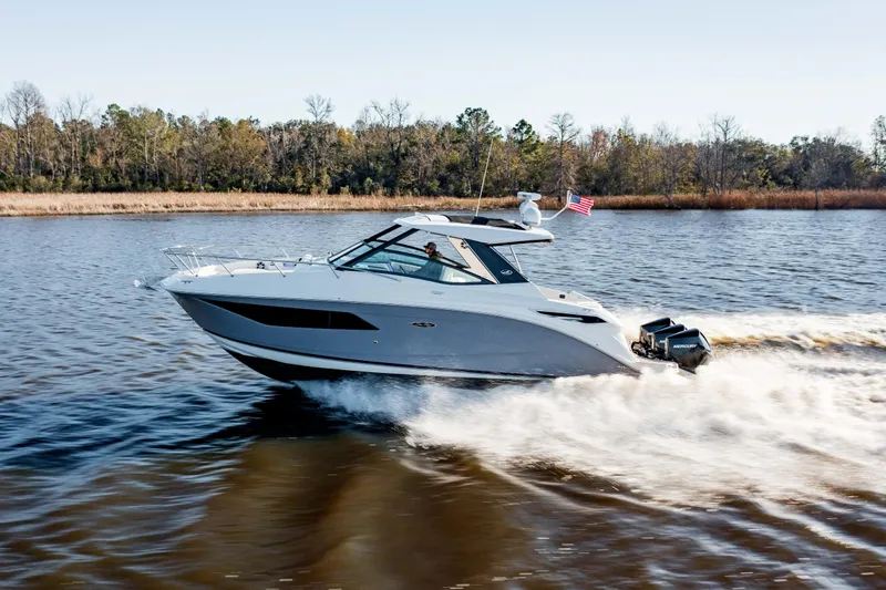  Yacht Photos Pics 2019 Sea Ray 320 Sundancer OB cruising on a lake.