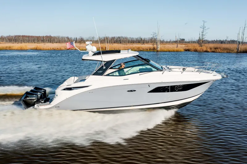  Yacht Photos Pics 2019 Sea Ray 320 Sundancer OB cruising on a river.