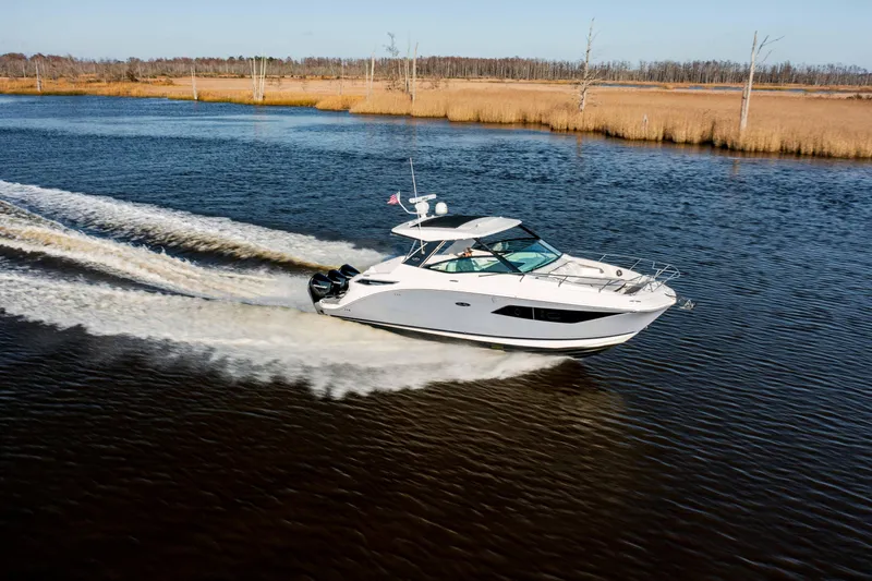  Yacht Photos Pics 2019 Sea Ray 320 Sundancer OB cruising on a river.