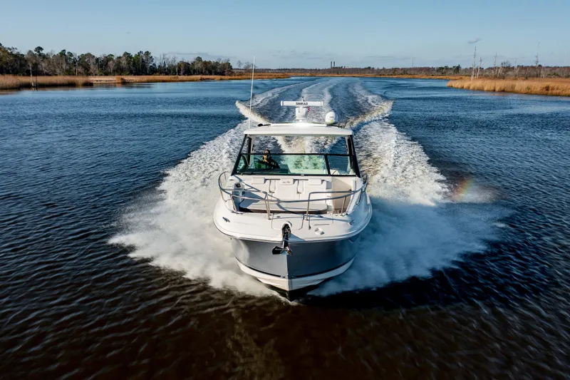  Yacht Photos Pics 2019 Sea Ray 320 Sundancer OB cruising on a calm river.