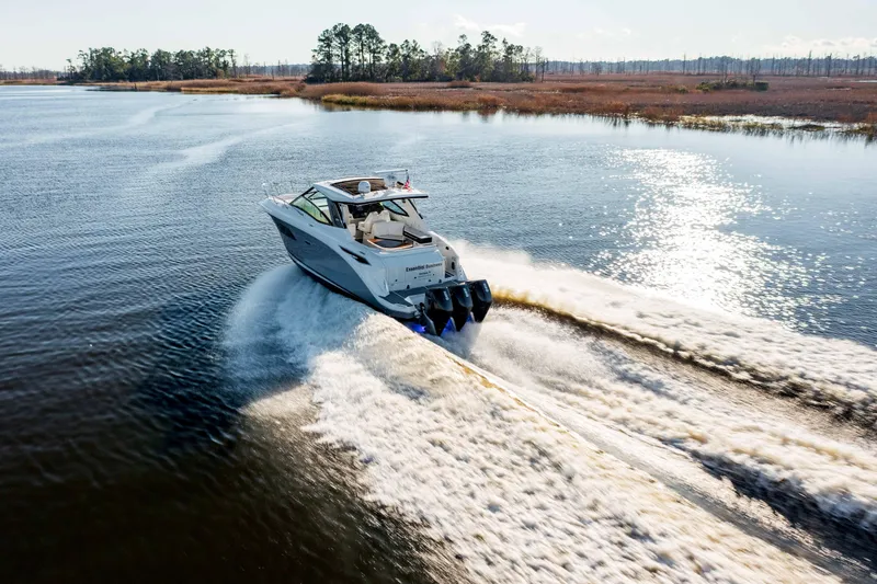  Yacht Photos Pics 2019 Sea Ray 320 Sundancer OB cruising on a serene lake.