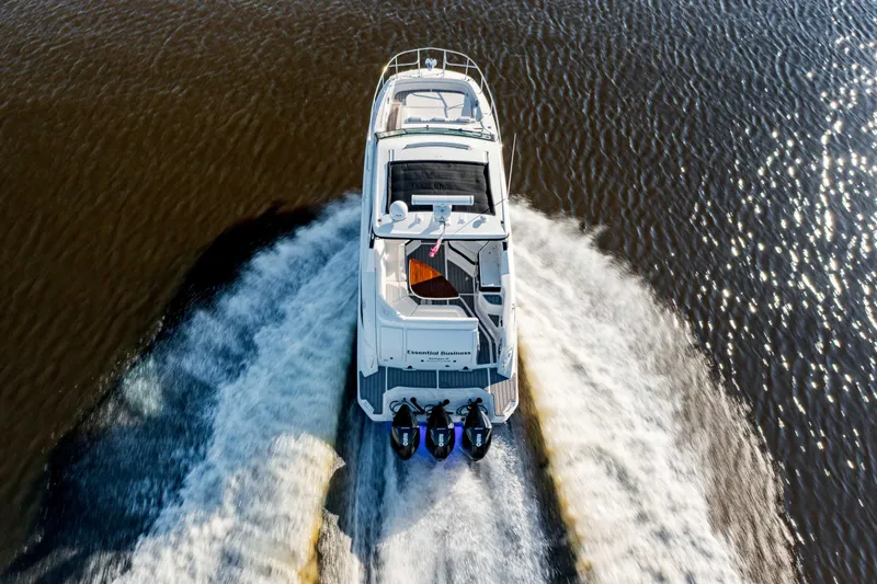  Yacht Photos Pics 2019 Sea Ray 320 Sundancer OB cruising on water, aerial view.