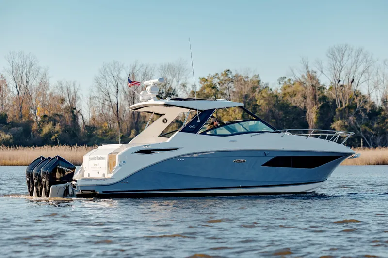  Yacht Photos Pics 2019 Sea Ray 320 Sundancer OB cruising on a calm lake.