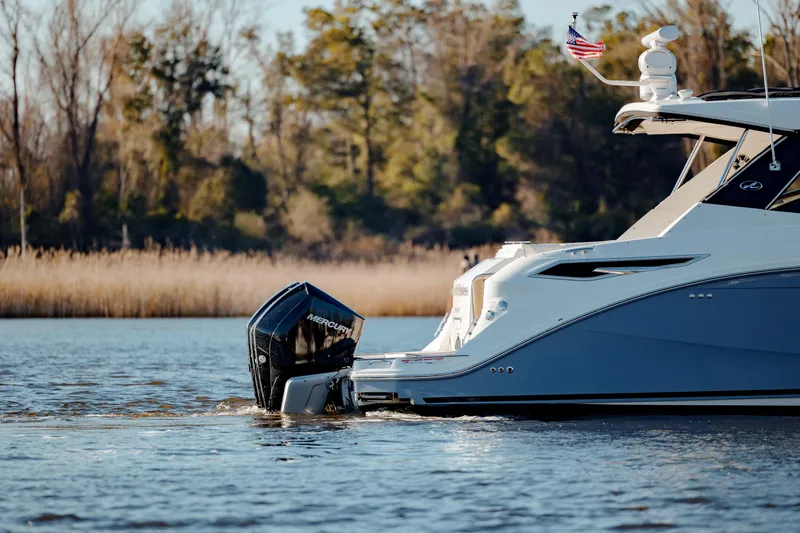  Yacht Photos Pics 2019 Sea Ray 320 Sundancer OB cruising on a calm lake.