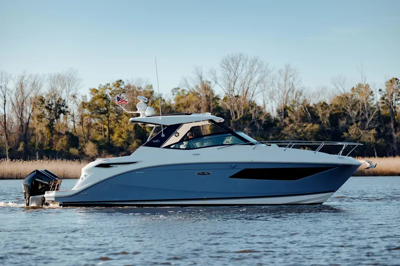  Yacht Photos Pics 2019 Sea Ray 320 Sundancer OB cruising on a calm river.