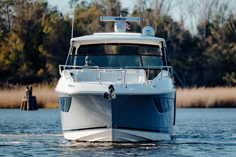  Yacht Photos Pics 2019 Sea Ray 320 Sundancer OB cruising on a calm lake.