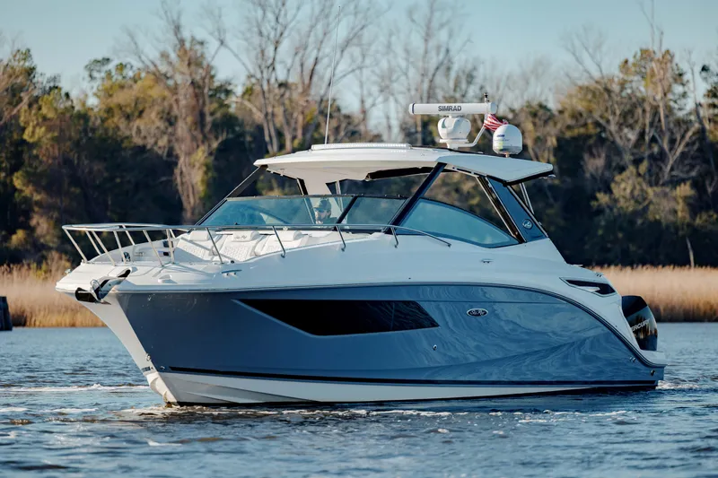  Yacht Photos Pics 2019 Sea Ray 320 Sundancer OB cruising on a calm lake.